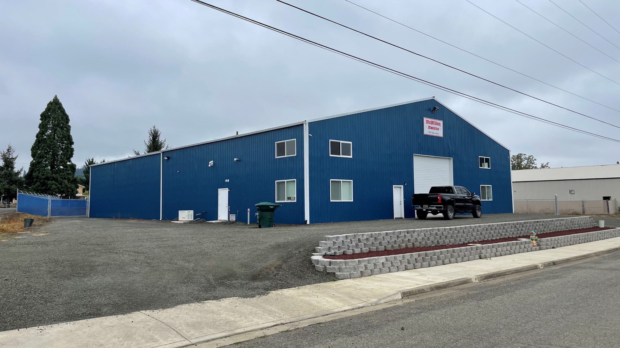 Large blue commercial post frame building