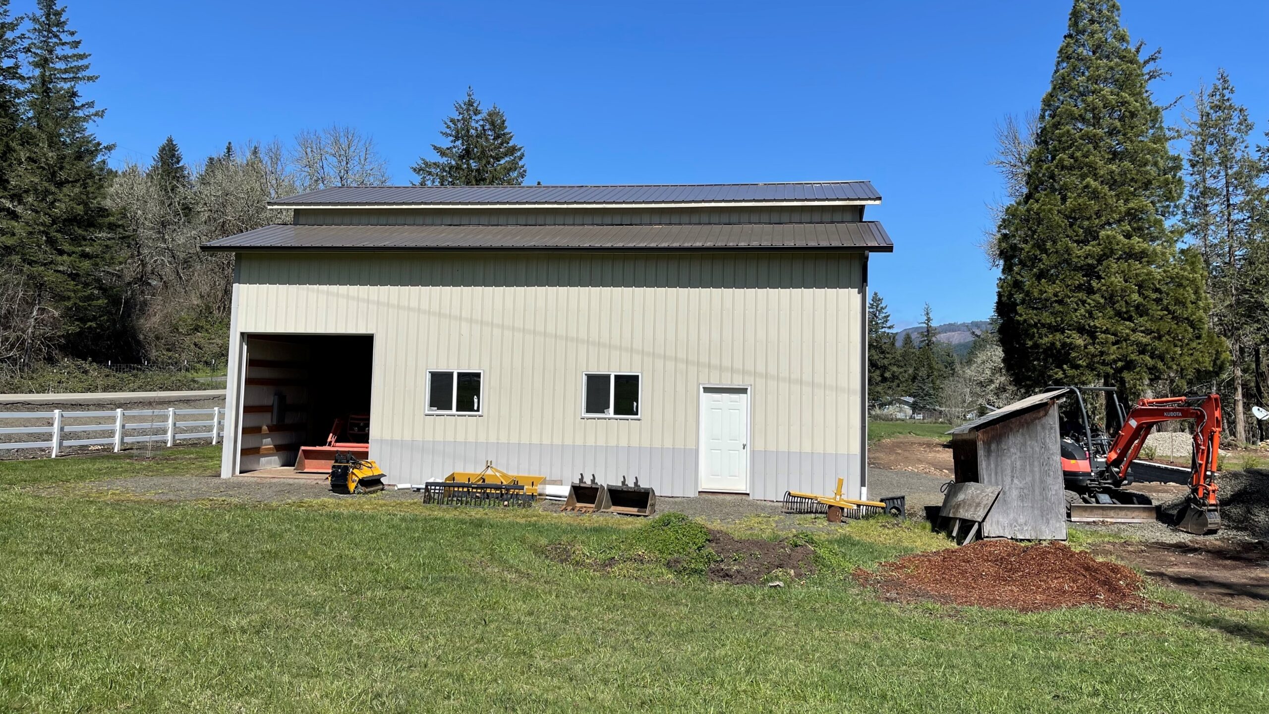 Commercial post frame building with large open bay