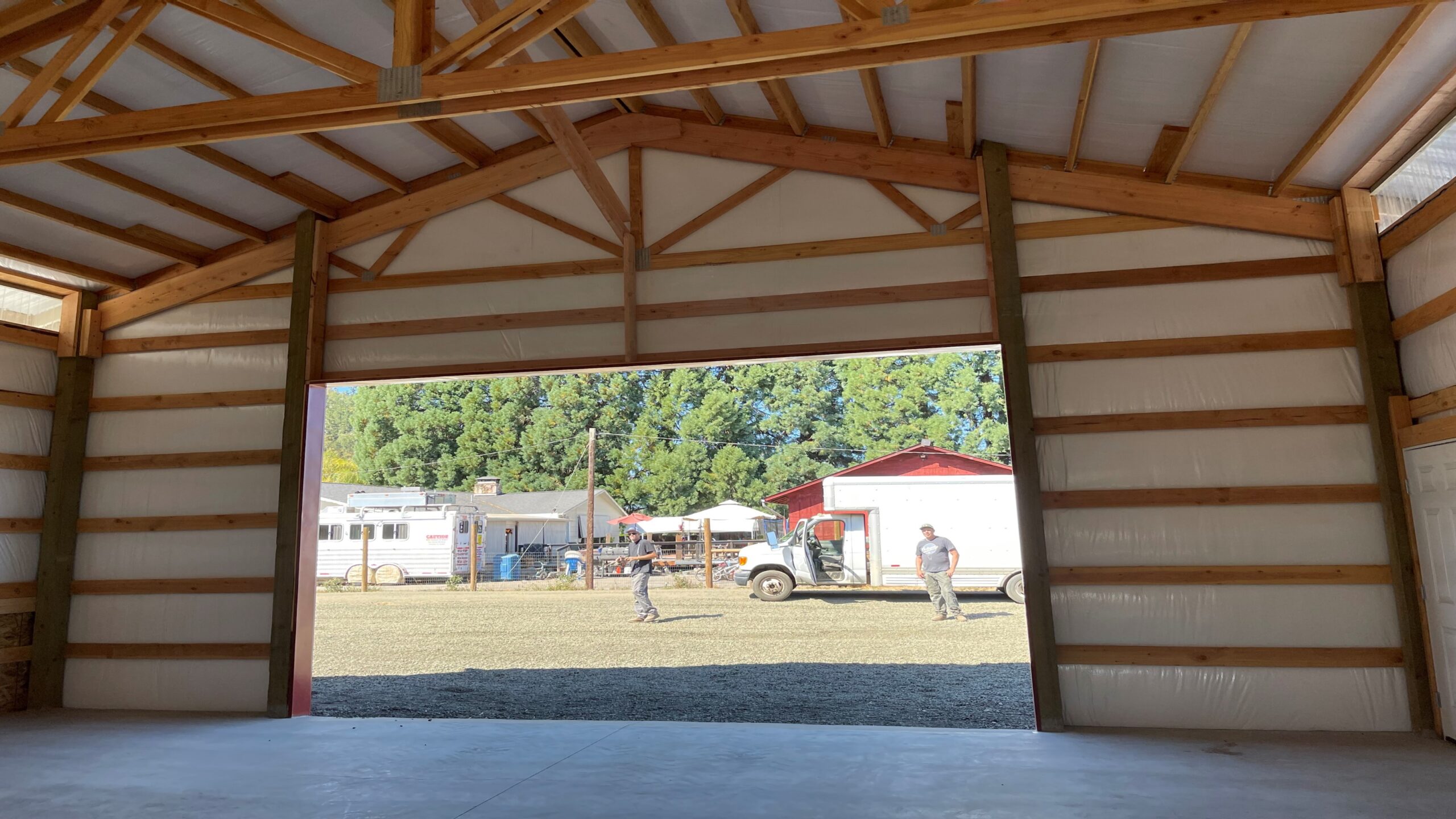 Interior view of post frame trusses and purlins in a JTW Construction building